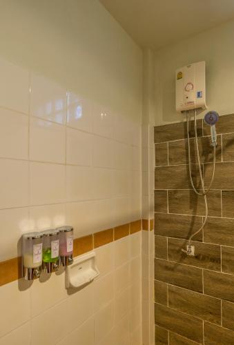 a shower stall in a bathroom with a shower at Lanta Manda Resort in Ko Lanta