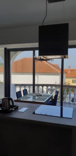 an office desk with a view of a building at Apartments Perina in Tisno