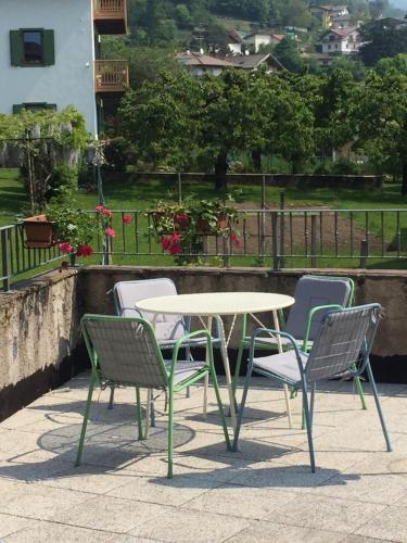 a table and two chairs and a table and chairs at CA' del GIACOMINO in Baselga di Pinè
