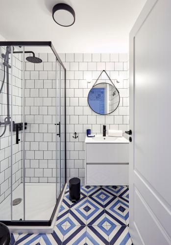 a bathroom with a shower and a sink at "Breeze" Aparthotel by Parrot`s House in Lloret de Mar