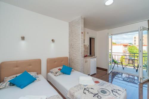 Postel nebo postele na pokoji v ubytování Apartmani Afterglow