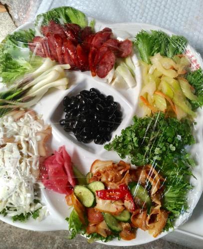 a plate of food with different types of vegetables at Hualien Tourism Sugar Factory Hotel in Guangfu