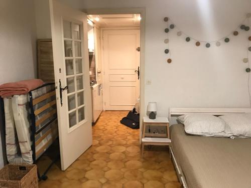 a bedroom with a bunk bed and a hallway at Studio in the center of Saint-Jean-cap-Ferrat in Saint-Jean-Cap-Ferrat