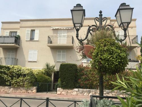 a building with a street light in front of it at Studio in the center of Saint-Jean-cap-Ferrat in Saint-Jean-Cap-Ferrat