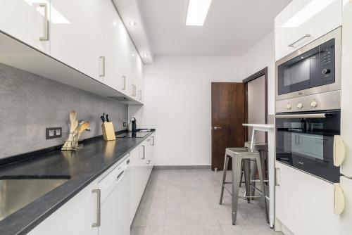 Kuchyň nebo kuchyňský kout v ubytování Puerto - Local Rentss