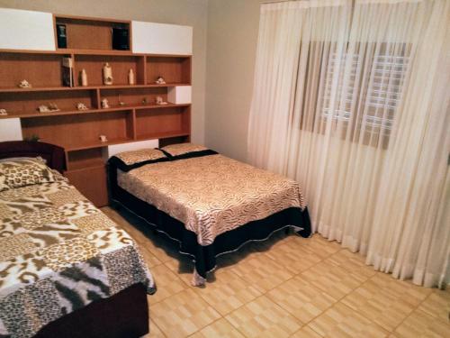 Postel nebo postele na pokoji v ubytování Chácara reis