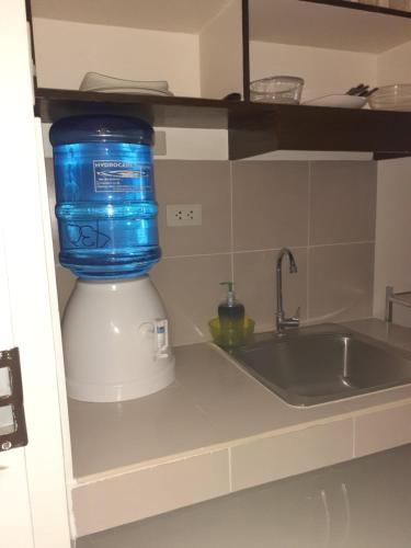 a food processor sitting on top of a kitchen counter at HappyNest 1857 @ Cityland Tagaytay in Tagaytay