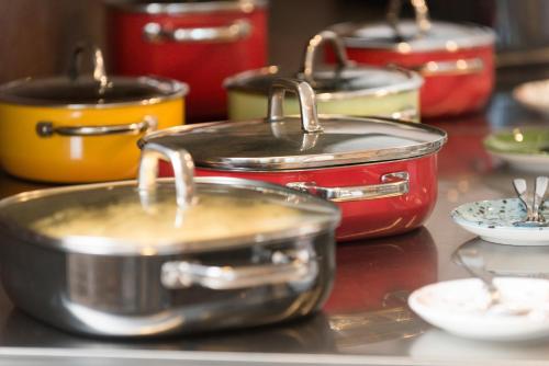 a group of pots and pans sitting on a table at Ramada by Wyndham Flensburg City in Flensburg