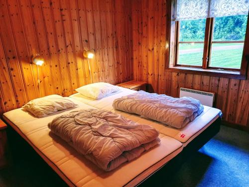 מיטה או מיטות בחדר ב-Klarälvsbyn