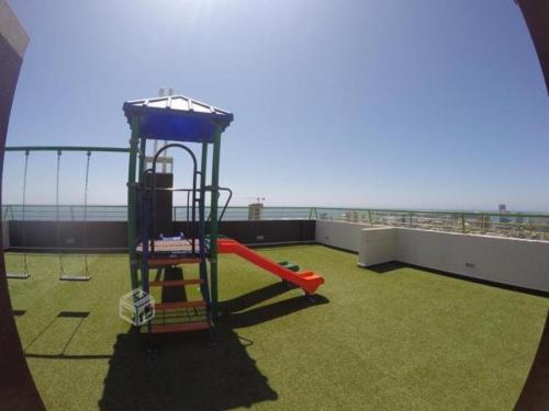 a playground on the roof of a building at Departamento NEO IQUIQUE VISTA AL MAR 3 in Iquique