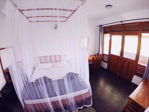 Postel nebo postele na pokoji v ubytování Lakshmis Hotel Ella