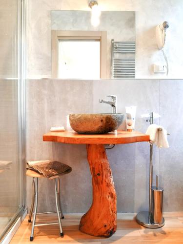 a bathroom with a sink on a wooden table at Aurora 5 Terre in La Spezia