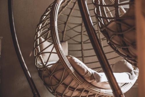 a woman is sitting in a basket at B&B Ca' Mea room, wellness & food in Levata