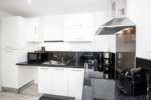 Η κουζίνα ή μικρή κουζίνα στο Aquitain Home chambre studio appartement Gare Saint Jean