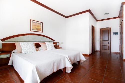 מיטה או מיטות בחדר ב-B&B Hotelito el Campo