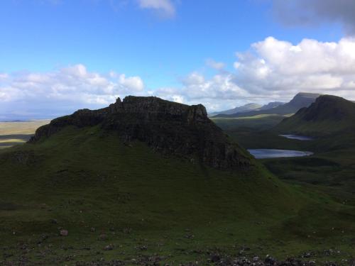 a mountain with a lake on top of it at Pooltiel View in Milovaig