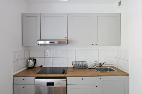 Kuchyňa alebo kuchynka v ubytovaní Ksiazat Pomorskich by Baltic Home