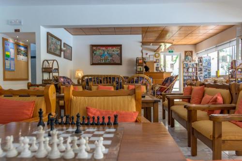a living room with a chess board and chairs at Missiria Apartments in Rethymno Town