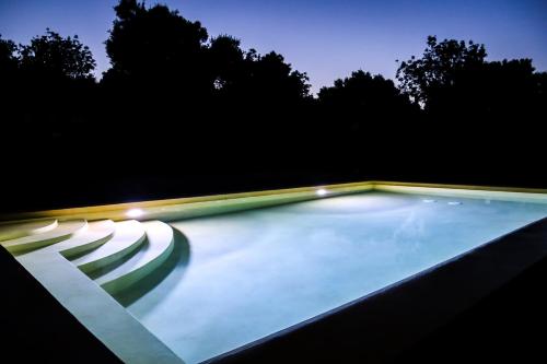 a swimming pool at night with lights at Villa Melite in Agios Nikolaos