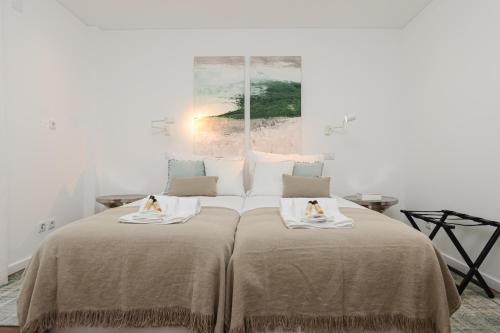 Voodi või voodid majutusasutuse Estrela Luxury Apartment toas