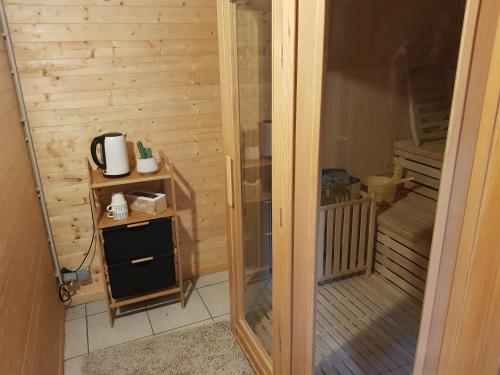 a door leading into a small room with a heater at Le Clos d'Any in Fontet