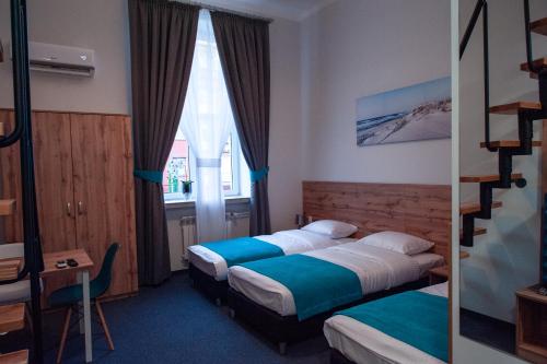 En eller flere senge i et værelse på Villa Centro