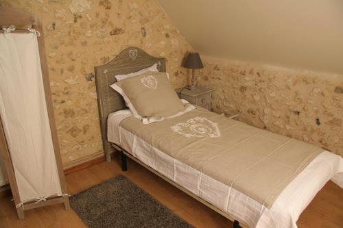 Una cama o camas en una habitación de Les Granges Indigo