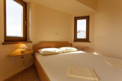 Ένα ή περισσότερα κρεβάτια σε δωμάτιο στο Apartman Vjekoslav