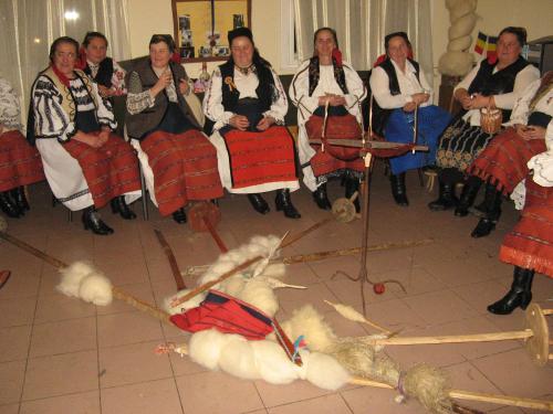 a group of women sitting on chairs in a room at Pensiunea Popasul Iancului in Mărişel