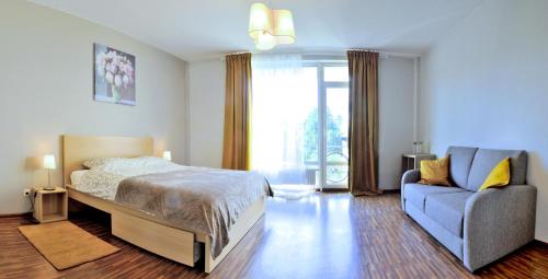 Postel nebo postele na pokoji v ubytování Kaminkelio apartment 44