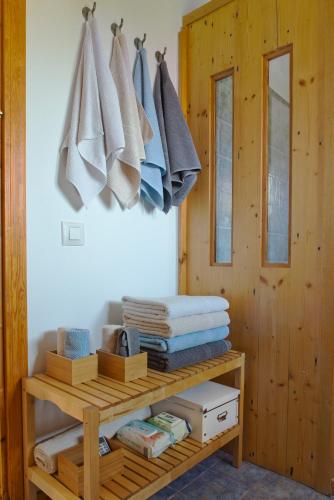 a pile of towels hanging on a wall in a room at La Casa de Enmedio in San Vicente del Valle