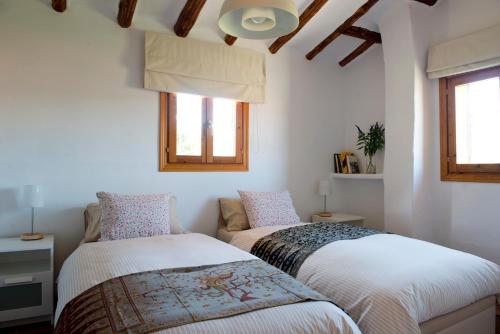 Un pat sau paturi într-o cameră la La Casa de Enmedio