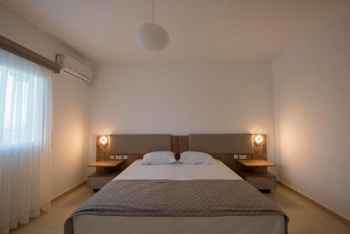 מיטה או מיטות בחדר ב-Deniz Airport Suites