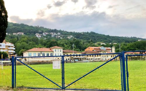 a train is traveling through a field in a city at FREE PARKING FRONT OF YOUR STUDIO 365d in Lovran