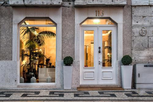 a store front with a white door at Lisboa Prata Boutique Hotel in Lisbon