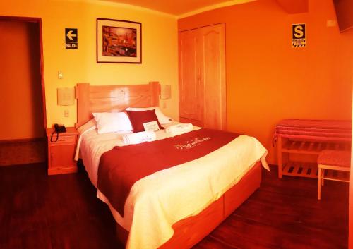 a bedroom with a large bed in a room at Morales Guest House in Huaraz