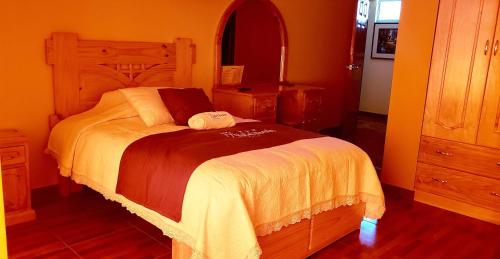 a bedroom with a large bed in a room at Morales Guest House in Huaraz