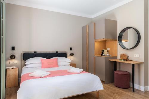 Ένα ή περισσότερα κρεβάτια σε δωμάτιο στο Viaggio Elegant Rooms