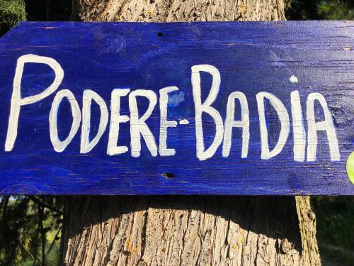 a blue sign on a tree with the words coffee bar at Podere Badia Valdrago Agriturismo Mugello Circuit in Scarperia