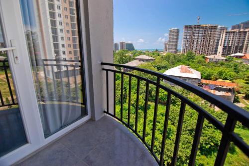 a balcony with a view of a city at HOTEL Dadu in Batumi