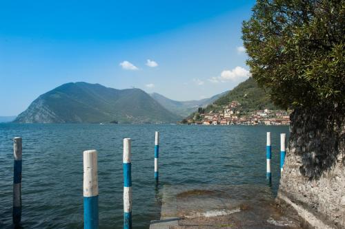 a view of a lake with poles in the water at La Casa del Comandante in Sulzano