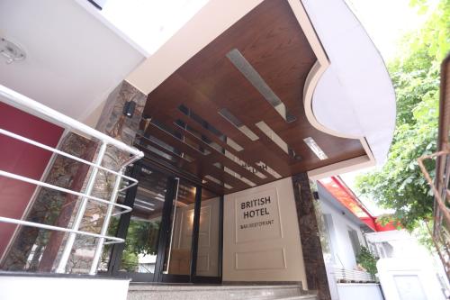 a building with a entrance to the british motel at British Hotel Pogradec in Pogradec