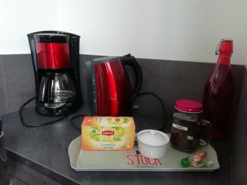 a counter top with a coffee maker and a blender at La Villa Tria Castella in Saint-Paul-Trois-Châteaux