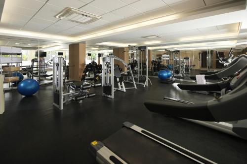 a gym with a lot of treadmills and machines at Casa Andina Select Chiclayo in Chiclayo