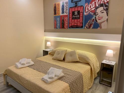 a bedroom with a bed with two towels on it at B&B In Centro in Crotone