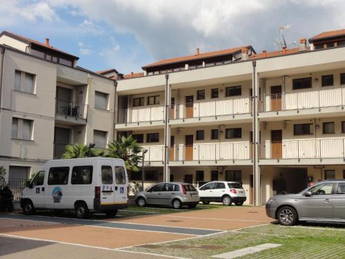 a white van parked in front of a building at Luxury Apartment Lake Como in Acquaseria