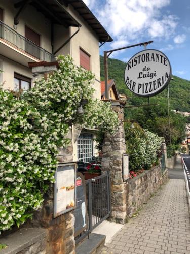 a sign on the side of a building at Luxury Apartment Lake Como in Acquaseria