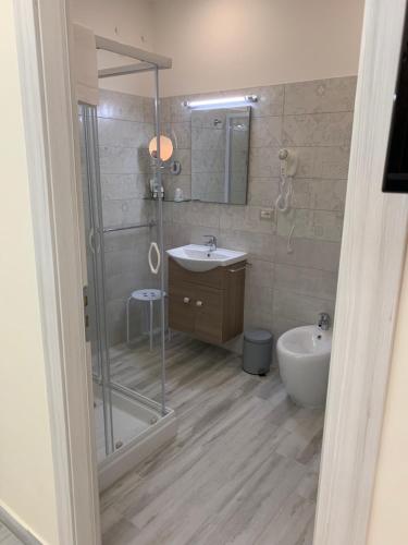 a bathroom with a shower and a sink and a toilet at B&B In Centro in Crotone