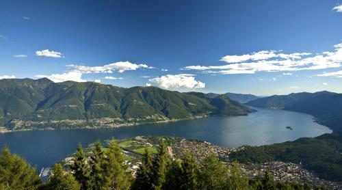 a view of a body of water with mountains at Casa La Berika in Orselina