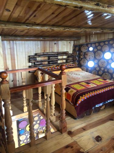 Postel nebo postele na pokoji v ubytování Rancho los Alebrijes Zacatlan